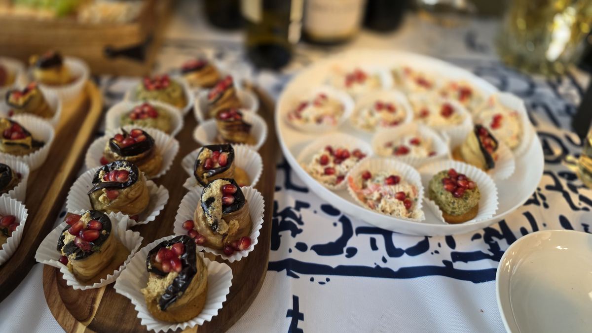 Badrijani eggplant rolls arranged on a serving board
